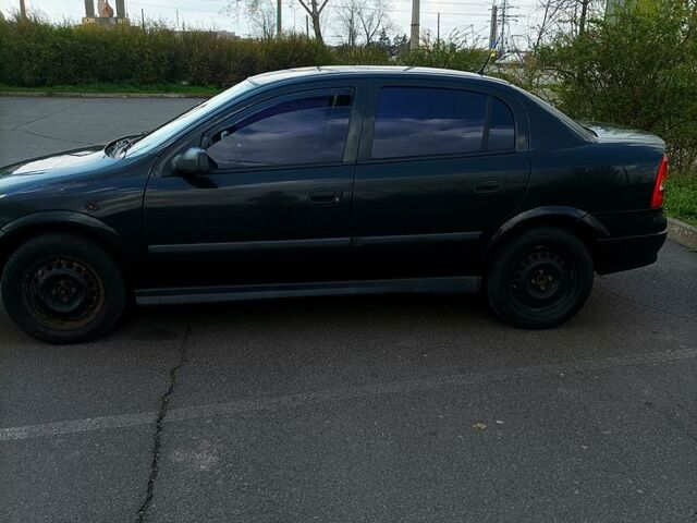 Черный Опель Астра, объемом двигателя 1.6 л и пробегом 212 тыс. км за 3800 $, фото 1 на Automoto.ua