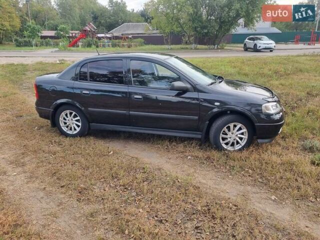 Черный Опель Астра, объемом двигателя 1.6 л и пробегом 171 тыс. км за 4250 $, фото 7 на Automoto.ua