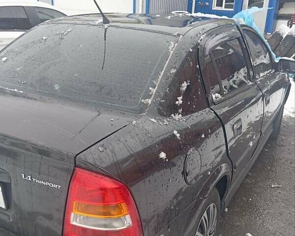 Черный Опель Астра, объемом двигателя 1.4 л и пробегом 150 тыс. км за 2300 $, фото 5 на Automoto.ua