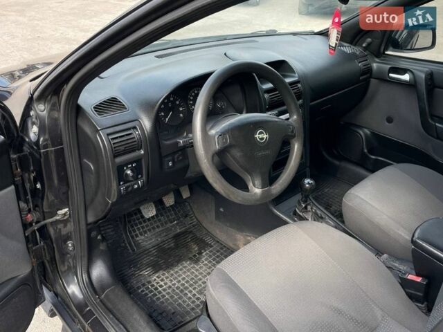 Черный Опель Астра, объемом двигателя 1.4 л и пробегом 270 тыс. км за 3000 $, фото 12 на Automoto.ua