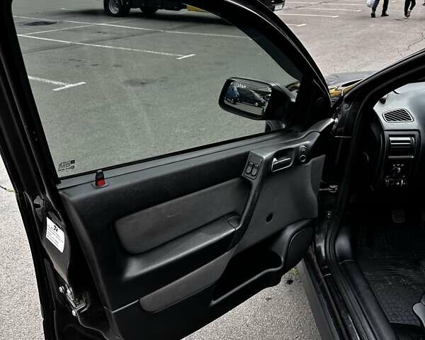 Черный Опель Астра, объемом двигателя 1.4 л и пробегом 277 тыс. км за 3300 $, фото 11 на Automoto.ua