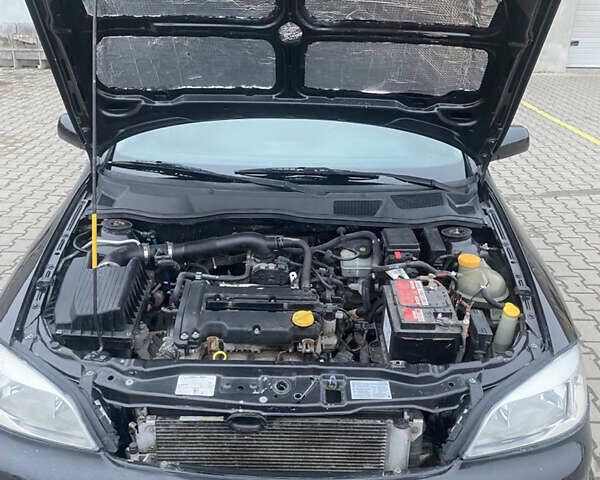 Черный Опель Астра, объемом двигателя 1.4 л и пробегом 229 тыс. км за 3200 $, фото 20 на Automoto.ua