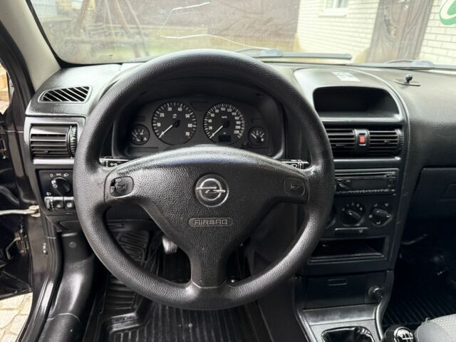 Черный Опель Астра, объемом двигателя 1.4 л и пробегом 160 тыс. км за 4000 $, фото 7 на Automoto.ua