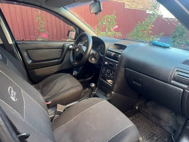 Черный Опель Астра, объемом двигателя 1.6 л и пробегом 151 тыс. км за 3700 $, фото 7 на Automoto.ua