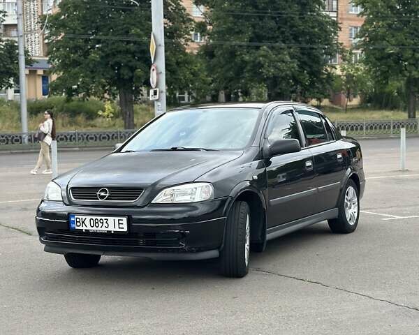 Черный Опель Астра, объемом двигателя 1.4 л и пробегом 277 тыс. км за 3300 $, фото 1 на Automoto.ua
