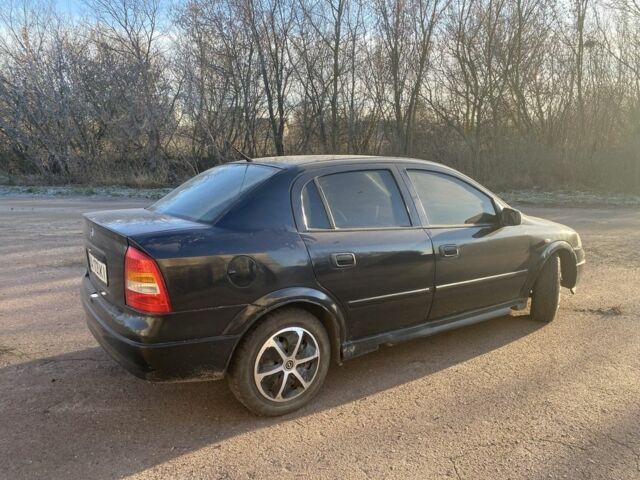 Черный Опель Астра, объемом двигателя 1.4 л и пробегом 219 тыс. км за 3400 $, фото 4 на Automoto.ua