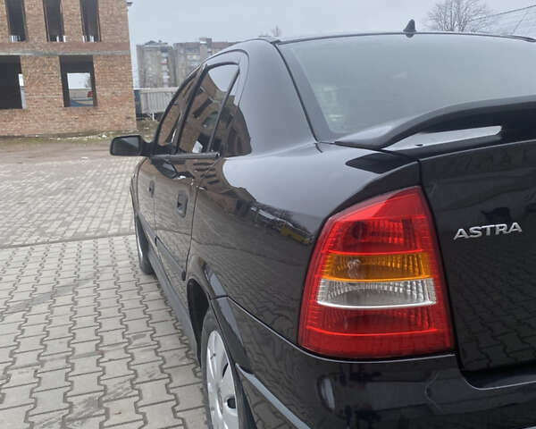 Черный Опель Астра, объемом двигателя 1.4 л и пробегом 229 тыс. км за 3200 $, фото 8 на Automoto.ua