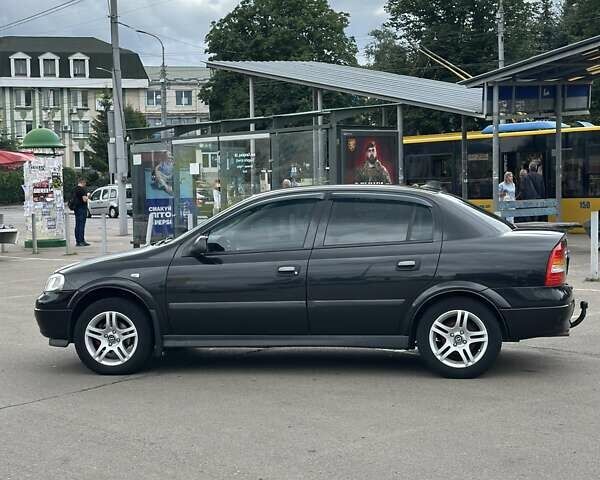Черный Опель Астра, объемом двигателя 1.4 л и пробегом 277 тыс. км за 3300 $, фото 2 на Automoto.ua