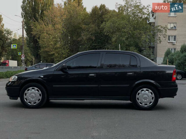 Черный Опель Астра, объемом двигателя 1.4 л и пробегом 90 тыс. км за 5900 $, фото 8 на Automoto.ua
