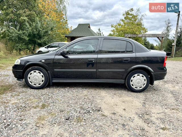 Черный Опель Астра, объемом двигателя 1.4 л и пробегом 176 тыс. км за 4390 $, фото 3 на Automoto.ua
