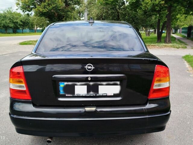 Черный Опель Астра, объемом двигателя 1.6 л и пробегом 213 тыс. км за 4100 $, фото 2 на Automoto.ua