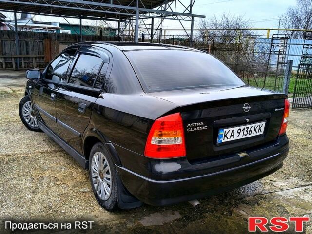 Черный Опель Астра, объемом двигателя 1.4 л и пробегом 250 тыс. км за 3999 $, фото 5 на Automoto.ua