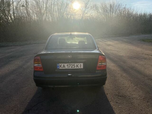 Черный Опель Астра, объемом двигателя 1.4 л и пробегом 219 тыс. км за 3400 $, фото 6 на Automoto.ua