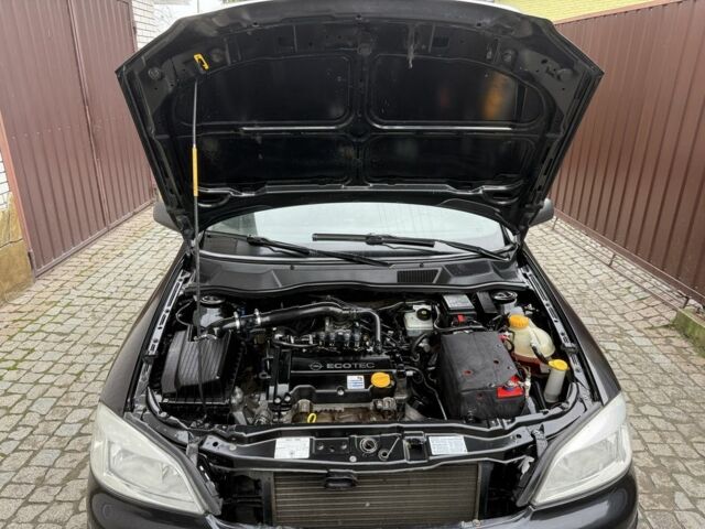 Черный Опель Астра, объемом двигателя 1.4 л и пробегом 160 тыс. км за 4000 $, фото 17 на Automoto.ua