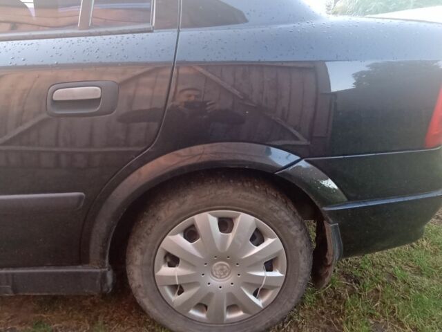 Черный Опель Астра, объемом двигателя 1.4 л и пробегом 129 тыс. км за 3700 $, фото 8 на Automoto.ua