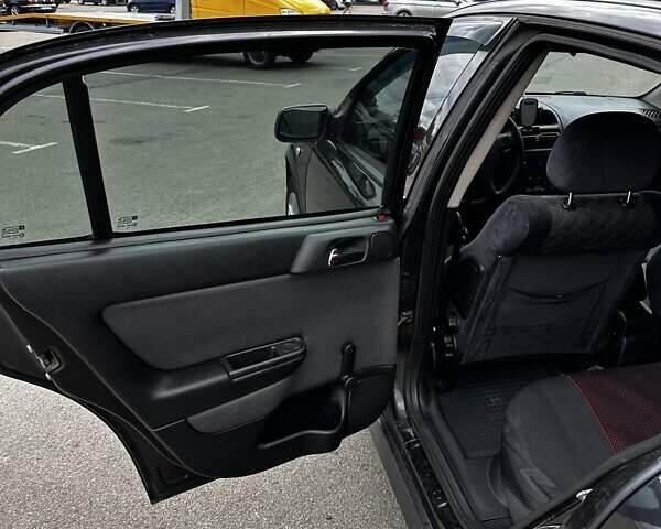 Черный Опель Астра, объемом двигателя 1.4 л и пробегом 277 тыс. км за 3300 $, фото 12 на Automoto.ua