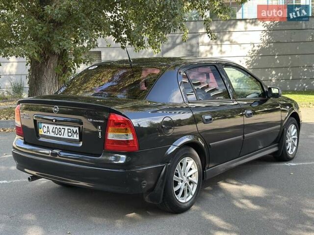 Черный Опель Астра, объемом двигателя 1.6 л и пробегом 170 тыс. км за 4300 $, фото 5 на Automoto.ua