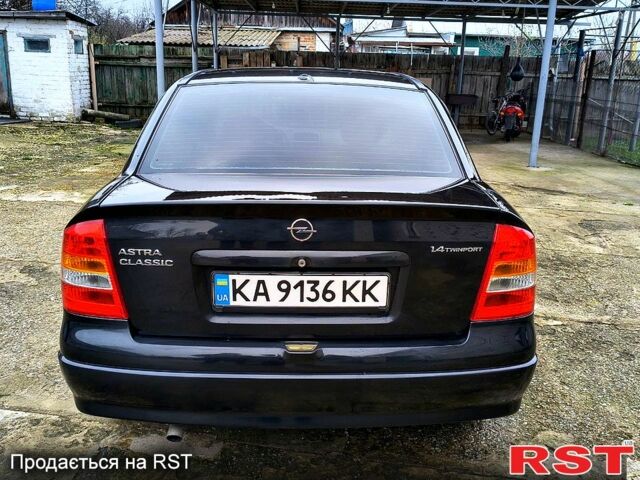 Черный Опель Астра, объемом двигателя 1.4 л и пробегом 250 тыс. км за 3999 $, фото 4 на Automoto.ua