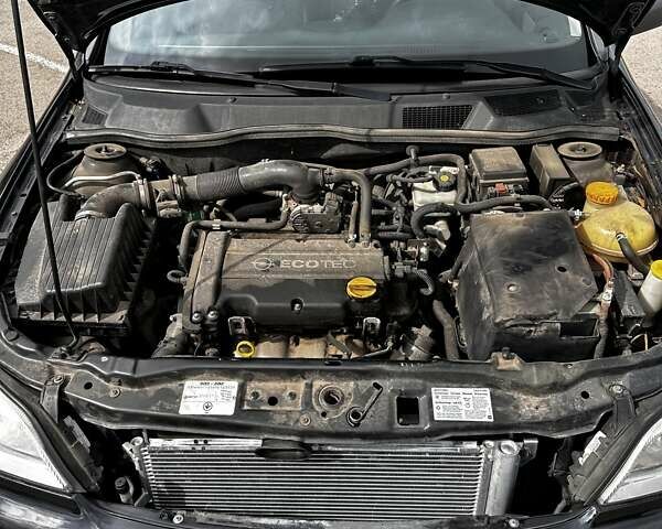 Черный Опель Астра, объемом двигателя 1.4 л и пробегом 277 тыс. км за 3300 $, фото 20 на Automoto.ua