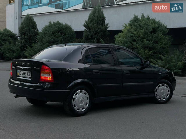 Черный Опель Астра, объемом двигателя 1.4 л и пробегом 90 тыс. км за 5900 $, фото 5 на Automoto.ua