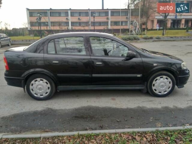 Черный Опель Астра, объемом двигателя 1.6 л и пробегом 198 тыс. км за 4100 $, фото 2 на Automoto.ua