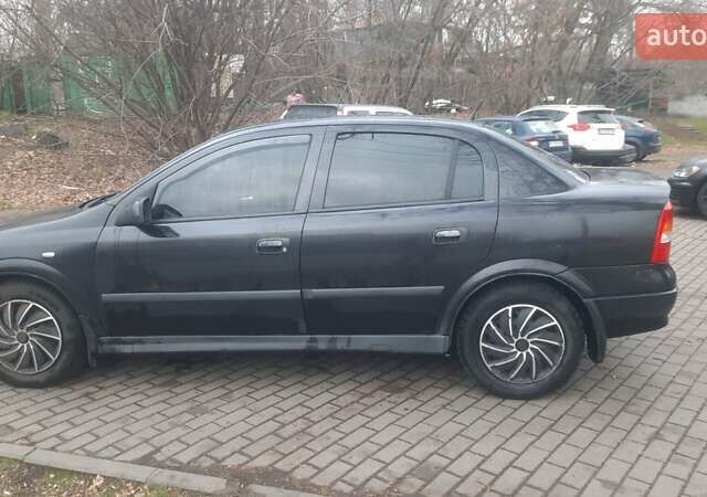 Черный Опель Астра, объемом двигателя 1.6 л и пробегом 277 тыс. км за 3400 $, фото 5 на Automoto.ua