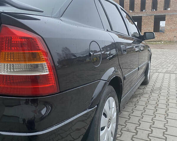 Черный Опель Астра, объемом двигателя 1.4 л и пробегом 229 тыс. км за 3200 $, фото 10 на Automoto.ua