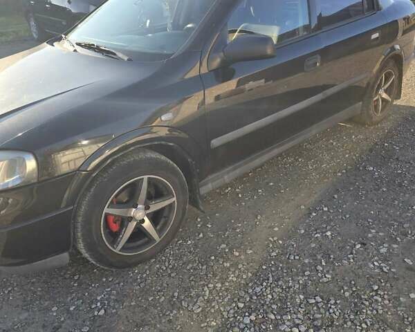 Черный Опель Астра, объемом двигателя 1.6 л и пробегом 217 тыс. км за 3800 $, фото 27 на Automoto.ua