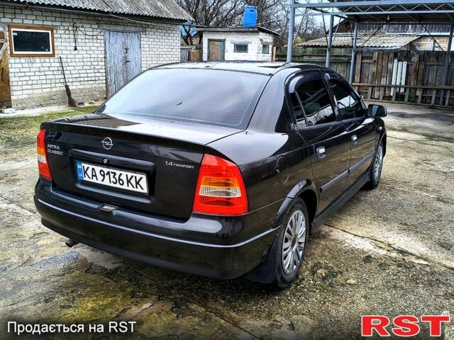 Черный Опель Астра, объемом двигателя 1.4 л и пробегом 250 тыс. км за 3999 $, фото 3 на Automoto.ua