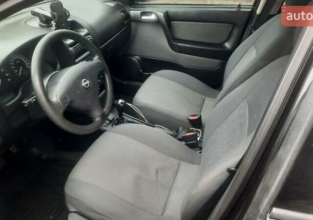 Черный Опель Астра, объемом двигателя 1.6 л и пробегом 277 тыс. км за 3400 $, фото 7 на Automoto.ua