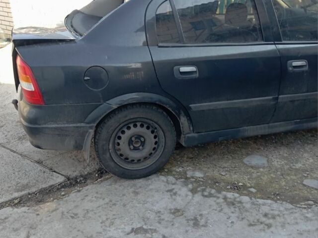 Черный Опель Астра, объемом двигателя 1.4 л и пробегом 171 тыс. км за 809 $, фото 7 на Automoto.ua