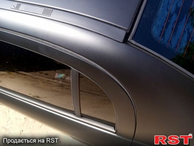 Черный Опель Астра, объемом двигателя 1.4 л и пробегом 100 тыс. км за 3300 $, фото 2 на Automoto.ua