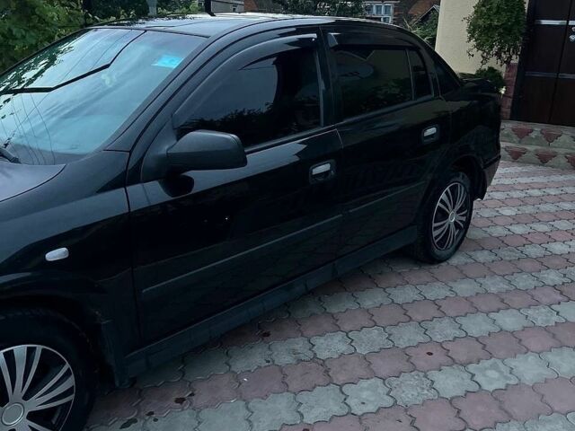 Черный Опель Астра, объемом двигателя 1.6 л и пробегом 207 тыс. км за 3500 $, фото 1 на Automoto.ua