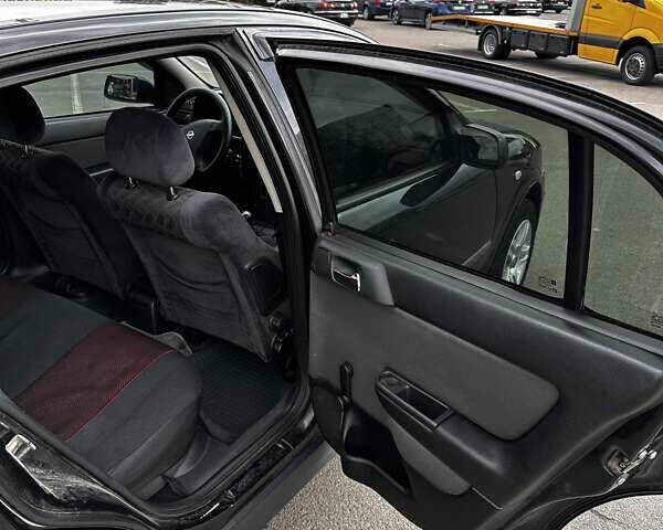 Черный Опель Астра, объемом двигателя 1.4 л и пробегом 277 тыс. км за 3300 $, фото 13 на Automoto.ua