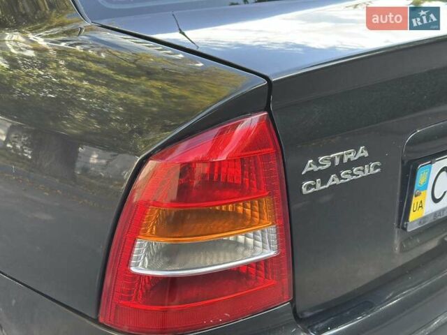 Черный Опель Астра, объемом двигателя 1.6 л и пробегом 170 тыс. км за 4300 $, фото 7 на Automoto.ua