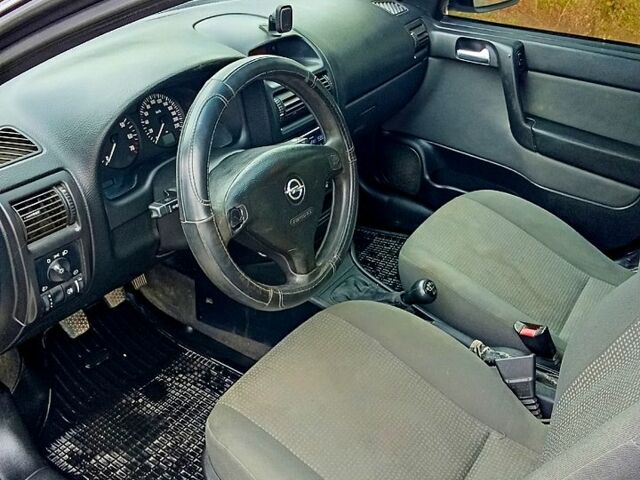 Черный Опель Астра, объемом двигателя 1.6 л и пробегом 179 тыс. км за 5000 $, фото 7 на Automoto.ua