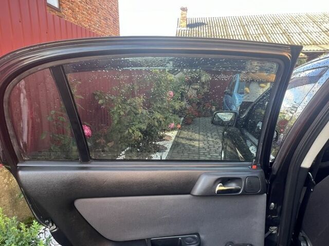 Черный Опель Астра, объемом двигателя 1.6 л и пробегом 151 тыс. км за 3700 $, фото 15 на Automoto.ua