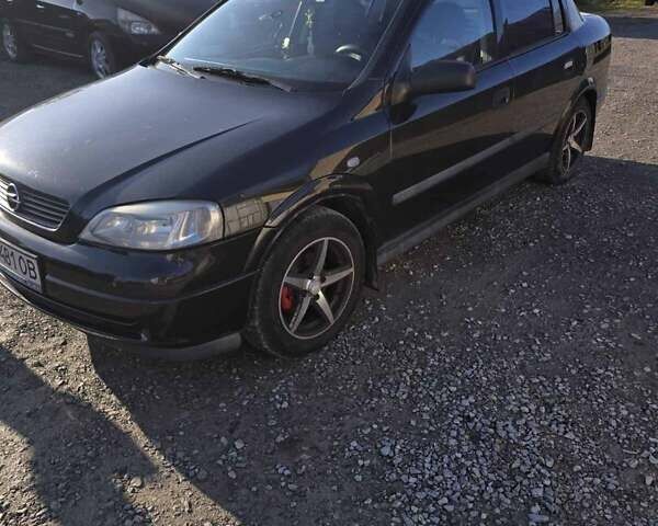 Черный Опель Астра, объемом двигателя 1.6 л и пробегом 217 тыс. км за 3800 $, фото 4 на Automoto.ua