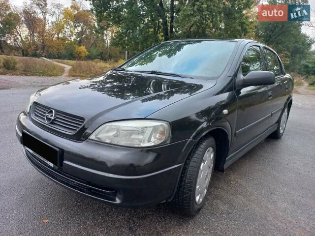 Черный Опель Астра, объемом двигателя 1.4 л и пробегом 230 тыс. км за 4500 $, фото 5 на Automoto.ua