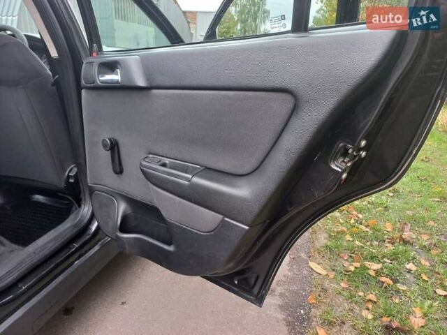 Черный Опель Астра, объемом двигателя 1.4 л и пробегом 220 тыс. км за 4500 $, фото 16 на Automoto.ua