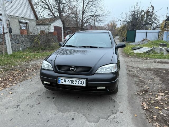 Черный Опель Астра, объемом двигателя 1.6 л и пробегом 250 тыс. км за 3750 $, фото 12 на Automoto.ua