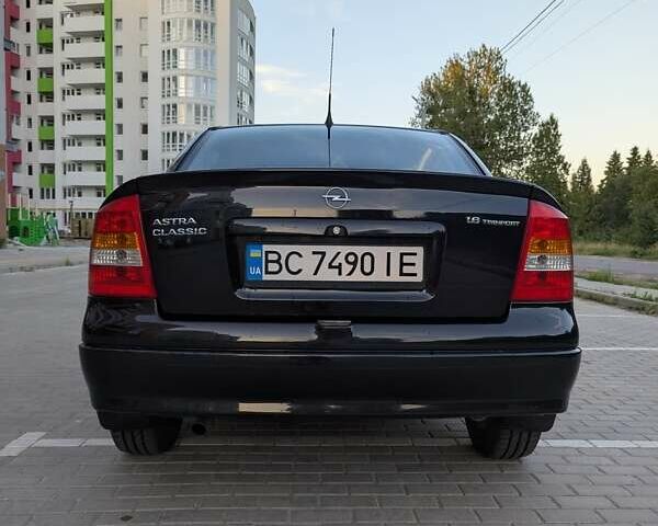 Черный Опель Астра, объемом двигателя 1.6 л и пробегом 215 тыс. км за 3900 $, фото 6 на Automoto.ua