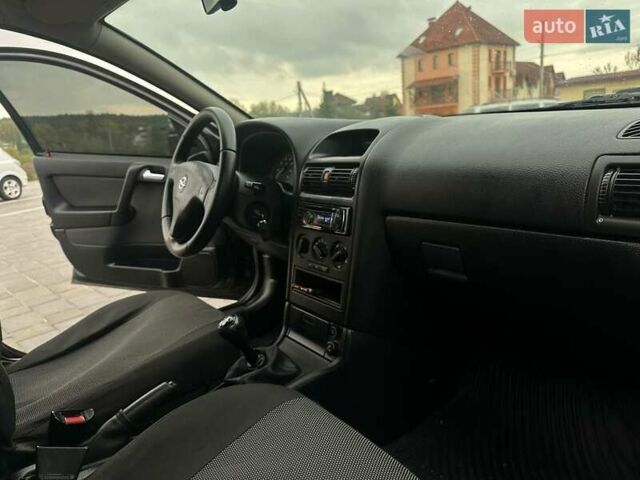 Черный Опель Астра, объемом двигателя 1.4 л и пробегом 216 тыс. км за 3999 $, фото 25 на Automoto.ua