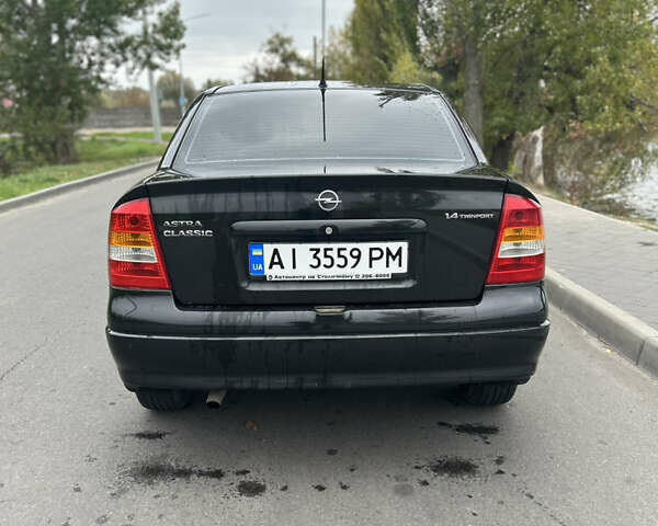 Черный Опель Астра, объемом двигателя 1.36 л и пробегом 193 тыс. км за 3700 $, фото 5 на Automoto.ua