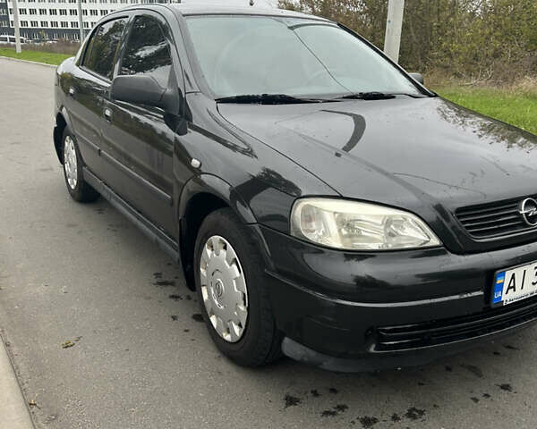 Черный Опель Астра, объемом двигателя 1.36 л и пробегом 193 тыс. км за 3700 $, фото 3 на Automoto.ua