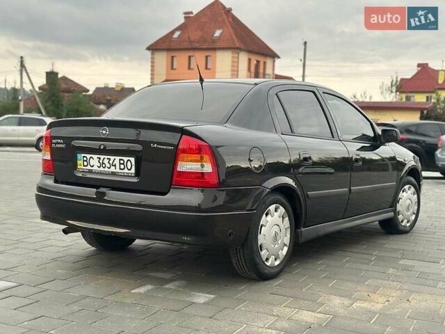 Черный Опель Астра, объемом двигателя 1.4 л и пробегом 216 тыс. км за 3999 $, фото 7 на Automoto.ua