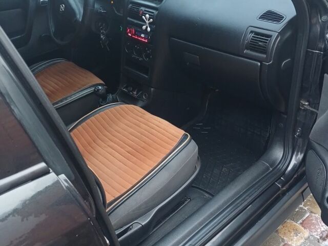 Черный Опель Астра, объемом двигателя 1.4 л и пробегом 362 тыс. км за 2600 $, фото 10 на Automoto.ua