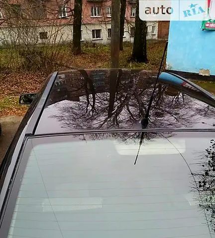 Черный Опель Астра, объемом двигателя 1.4 л и пробегом 155 тыс. км за 3500 $, фото 2 на Automoto.ua