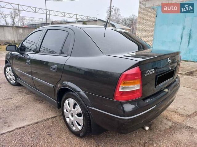 Черный Опель Астра, объемом двигателя 1.4 л и пробегом 230 тыс. км за 4500 $, фото 3 на Automoto.ua