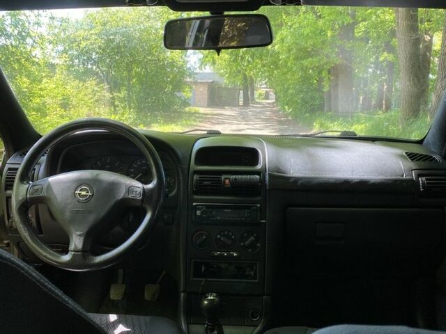 Черный Опель Астра, объемом двигателя 1.6 л и пробегом 470 тыс. км за 3000 $, фото 7 на Automoto.ua